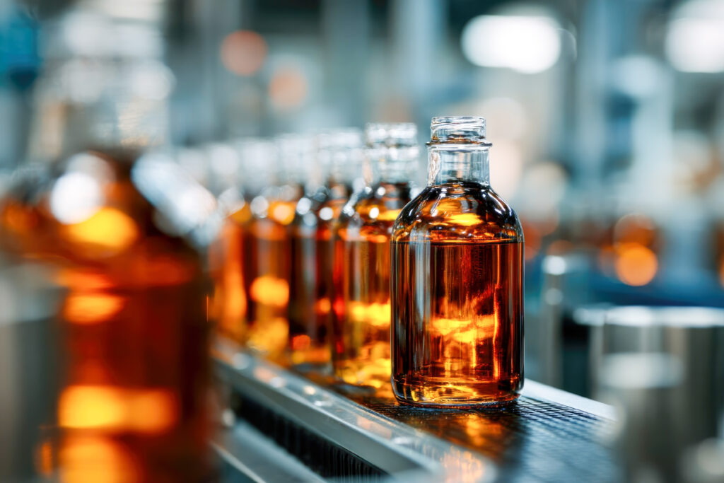 Pharmaceutical or food processing production line with glass bottles and liquid filling system