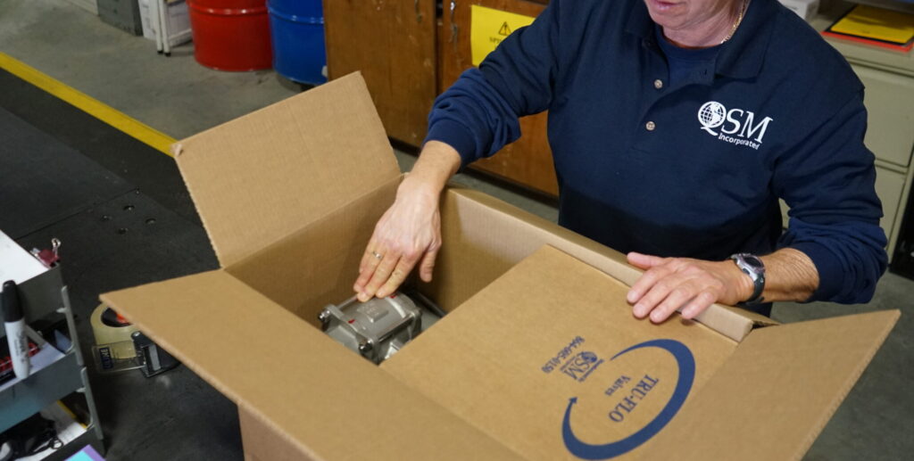 Packaging stainless steel valve in protective box for safe shipping and delivery